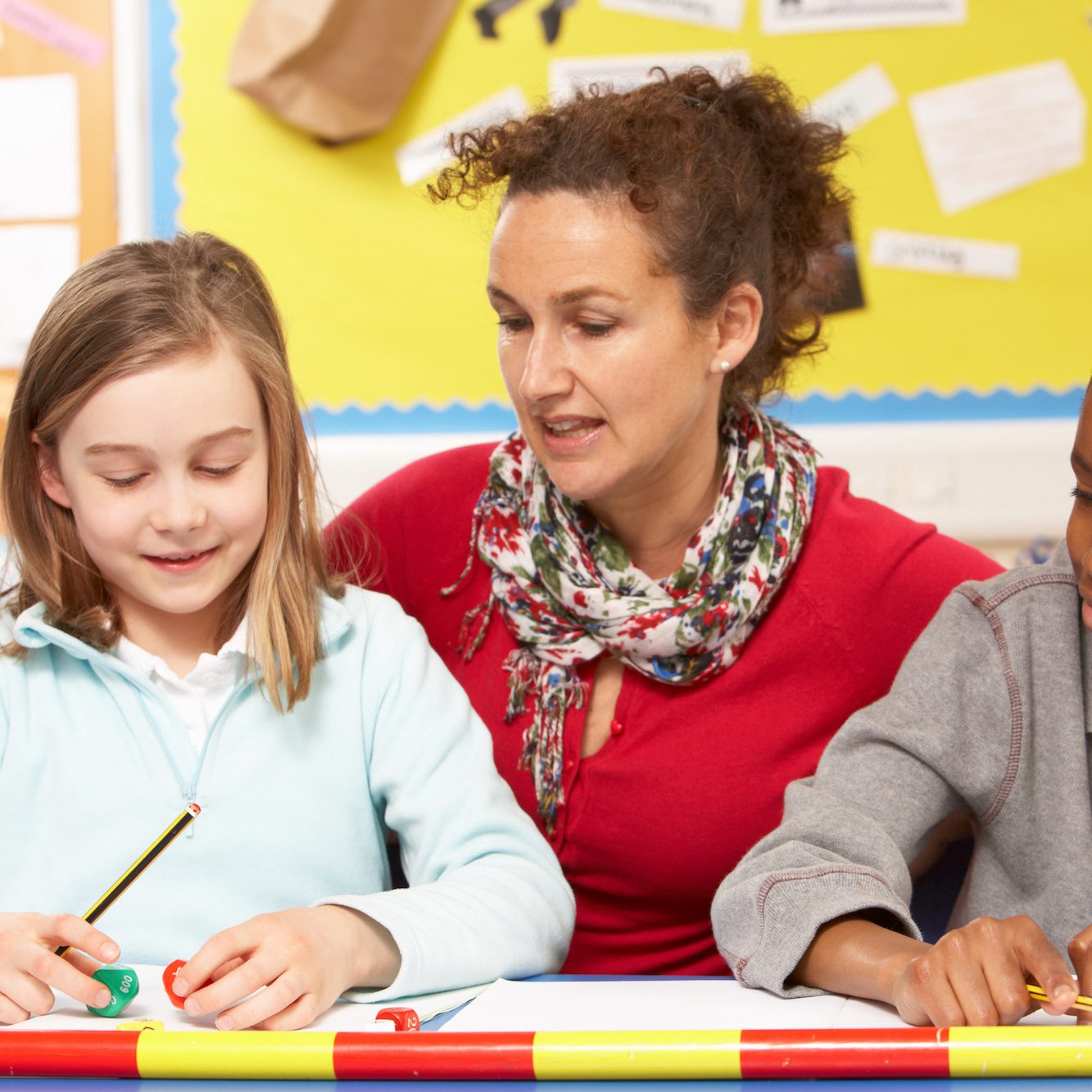 Schoolgirl,And,Schoolboy,Studying,In,Classroom,With,Teacher